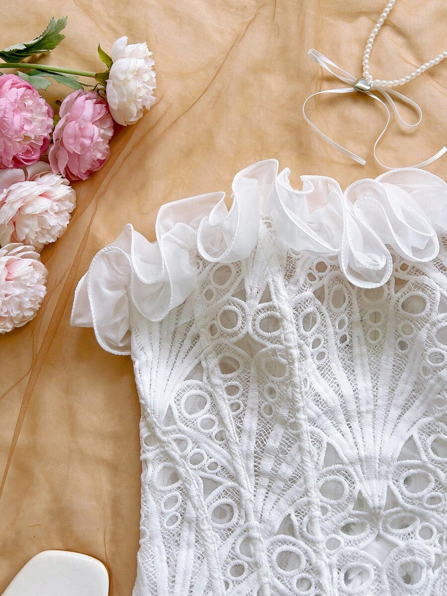 Strapless floral corset top with lace-up detail, asymmetrical hem, and slim fit for women in a boho vacation style.