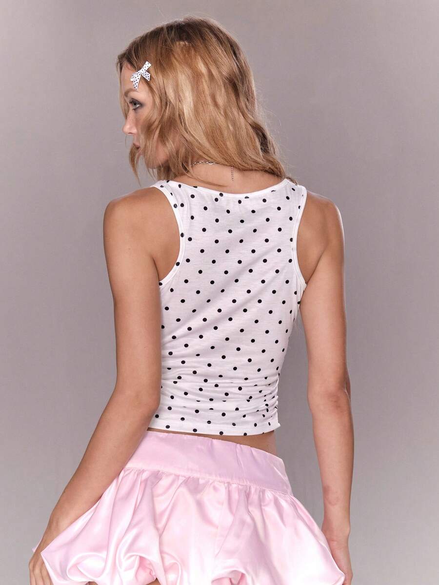 White slim fit square neck polka dot camisole top featuring cat and butterfly graphic print with studded arm sleeves.