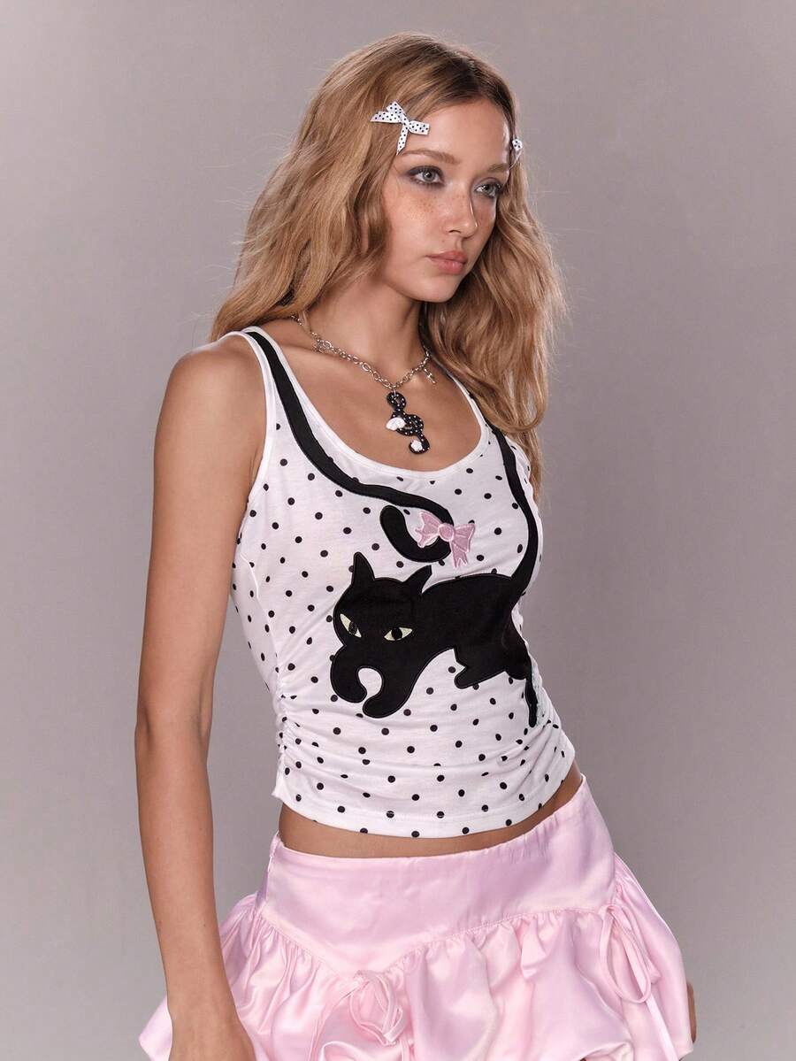 White slim fit square neck polka dot camisole top featuring cat and butterfly graphic print with studded arm sleeves.