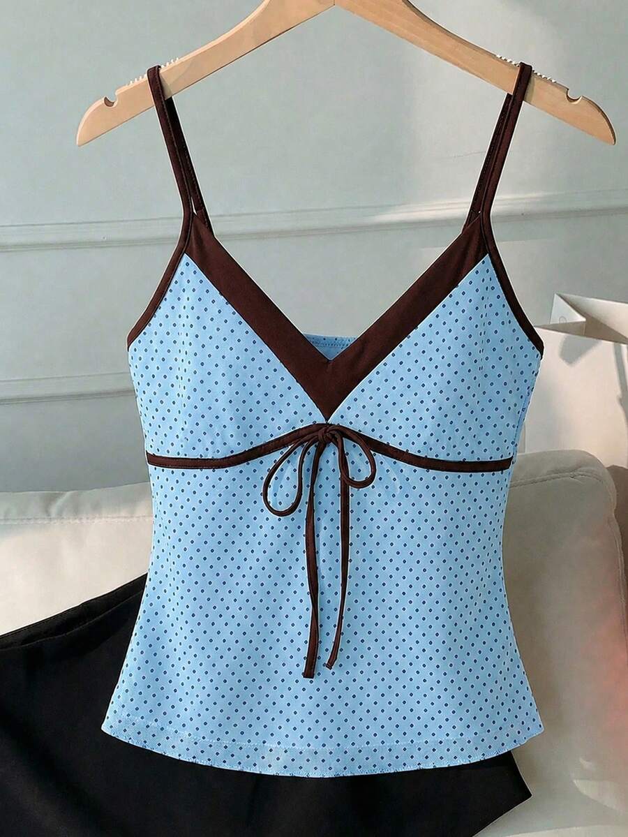 Black and white polka dot tie strap camisole top for women with thin spaghetti straps and slim fit.