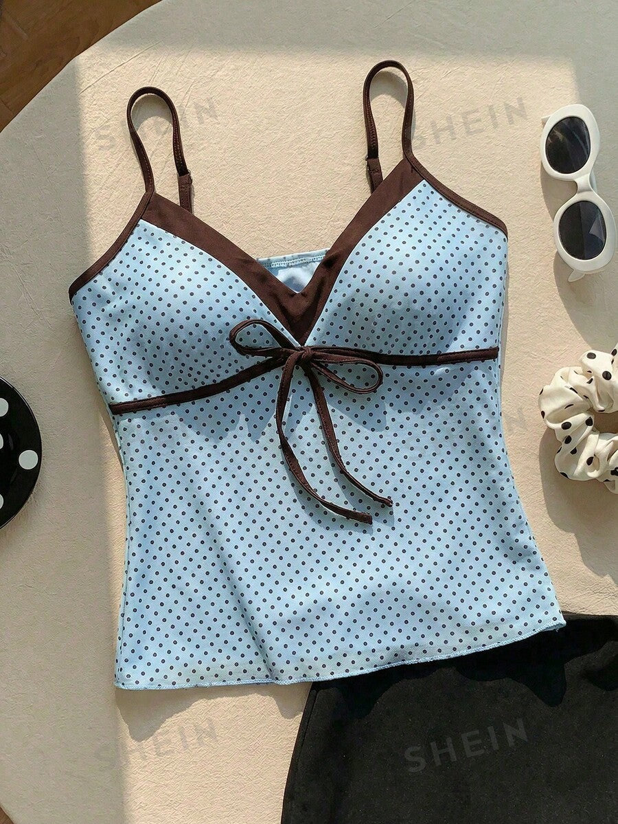 Black and white polka dot tie strap camisole top for women with thin spaghetti straps and slim fit.
