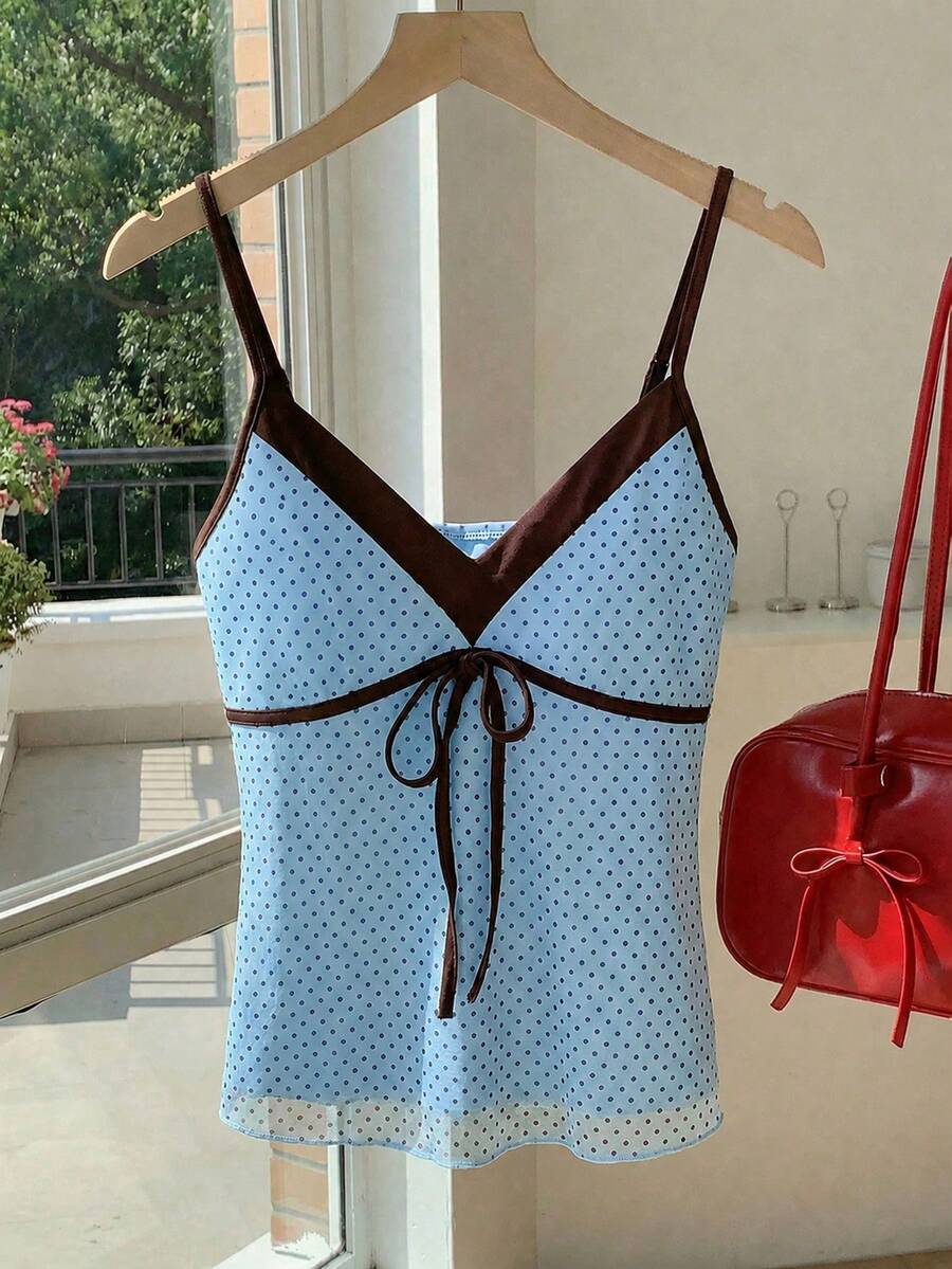 Black and white polka dot tie strap camisole top for women with thin spaghetti straps and slim fit.