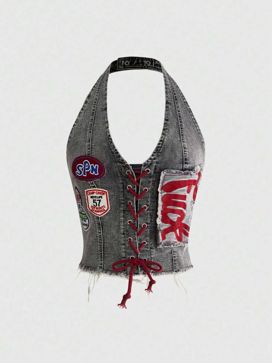 A black Y2K denim halter crop top featuring a backless lace-up grommet eyelet design with a slim fit micro crop length.