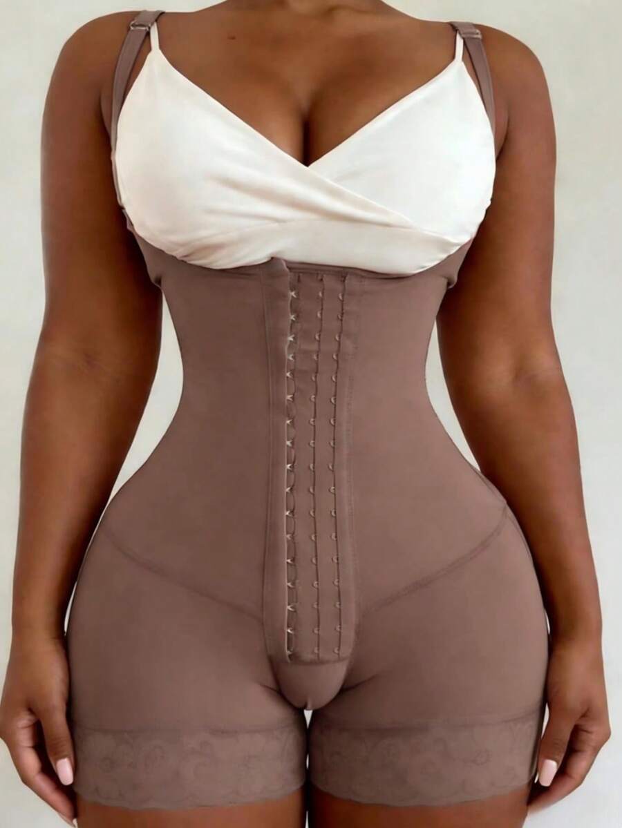 Women's apricot body shaper jumpsuit with 4-row hook and eye front closure and contrast lace details.
