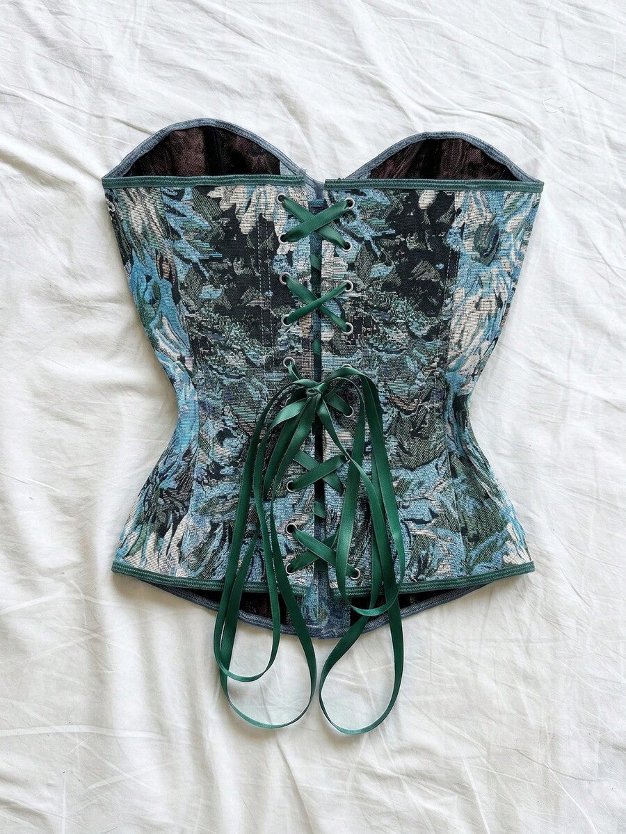 Strapless black lace-up corset top for women with grommet eyelet details, slim fit, lined body, and woven fabric construction.