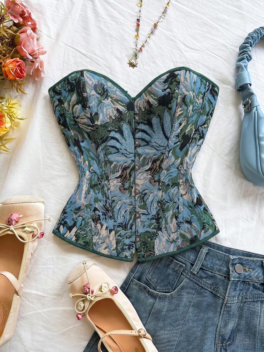 Strapless black lace-up corset top for women with grommet eyelet details, slim fit, lined body, and woven fabric construction.