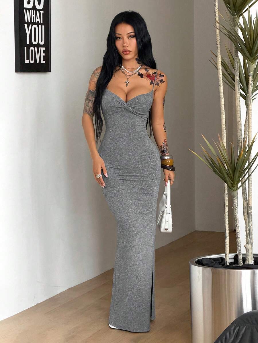 Women's Y2K backless spaghetti strap maxi dress featuring a lace-up back and high split thigh in black knitted fabric.