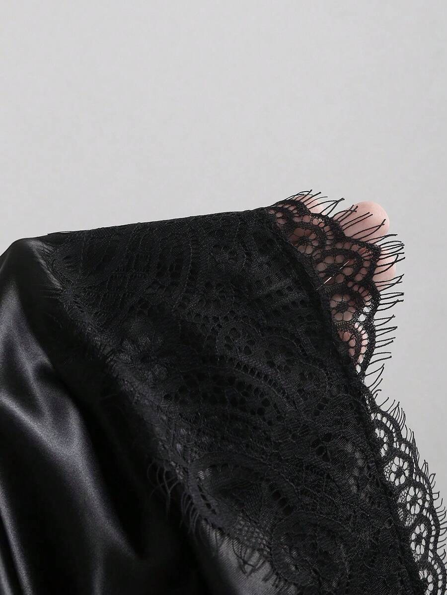 Black satin bodycon short skirt featuring contrast lace trim and mid-waist fit for women