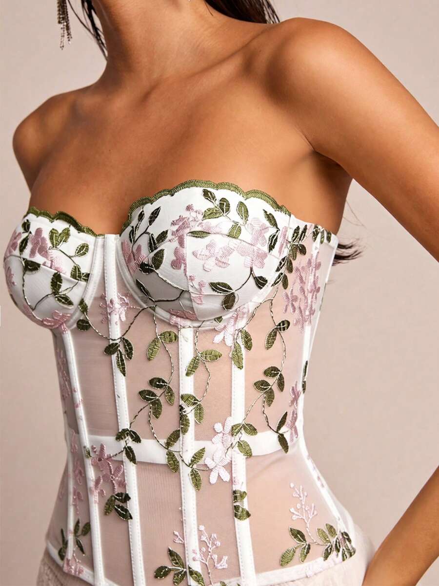 White botanical embroidered mesh bustier crop top for women featuring a strapless boned silhouette and slim crop fit.