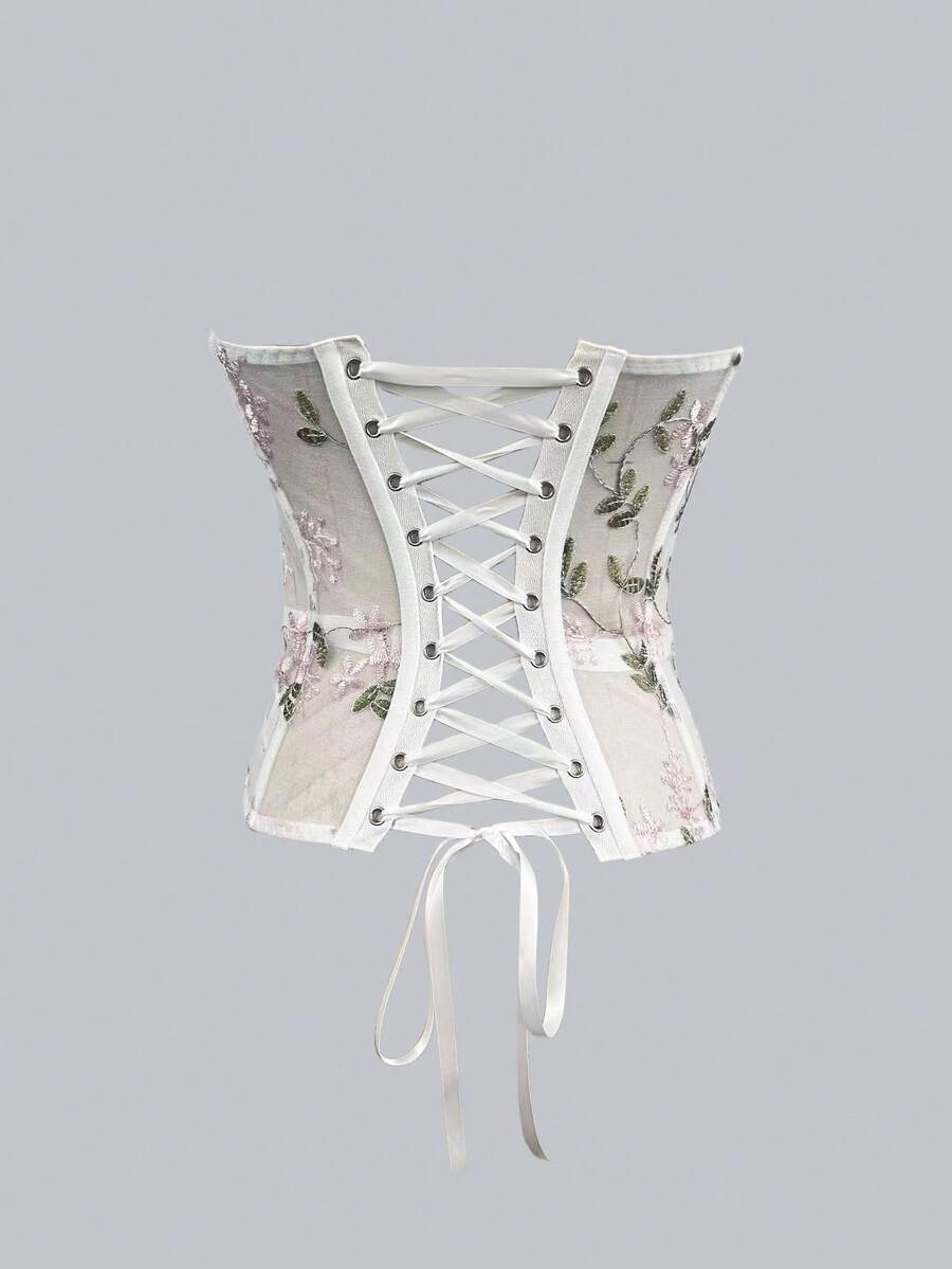 White botanical embroidered mesh bustier crop top for women featuring a strapless boned silhouette and slim crop fit.