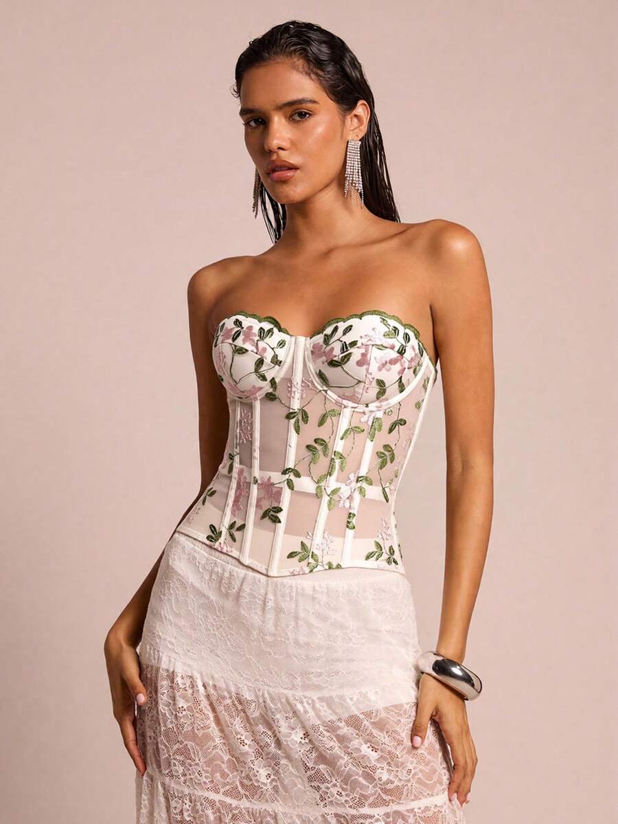 White botanical embroidered mesh bustier crop top for women featuring a strapless boned silhouette and slim crop fit.