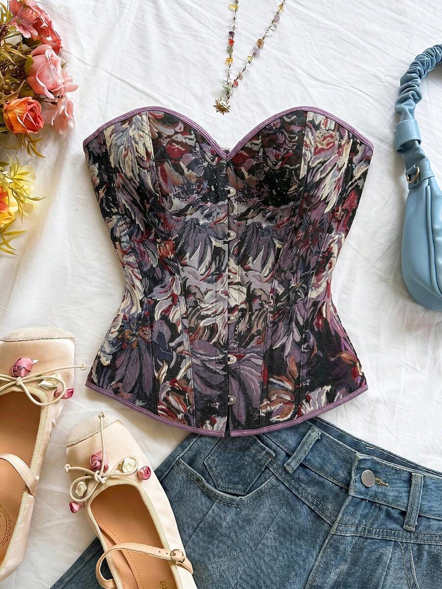 Strapless black lace-up corset top for women with grommet eyelet details, slim fit, lined body, and woven fabric construction.