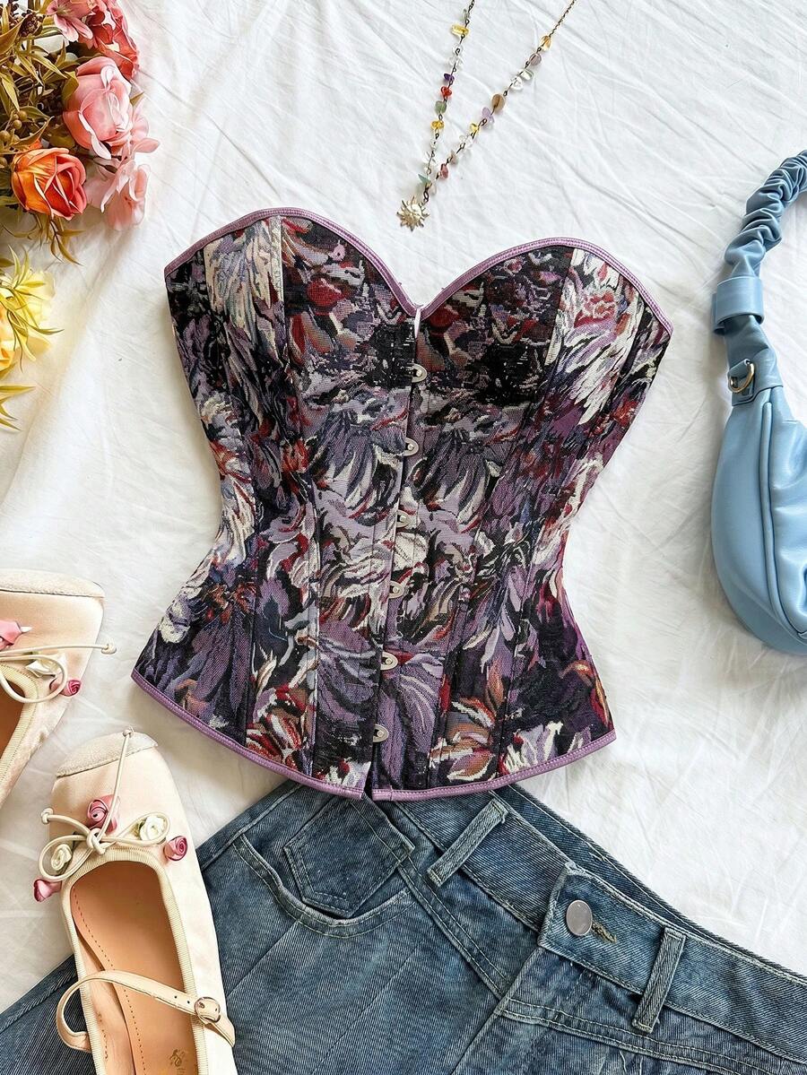 Strapless black lace-up corset top for women with grommet eyelet details, slim fit, lined body, and woven fabric construction.