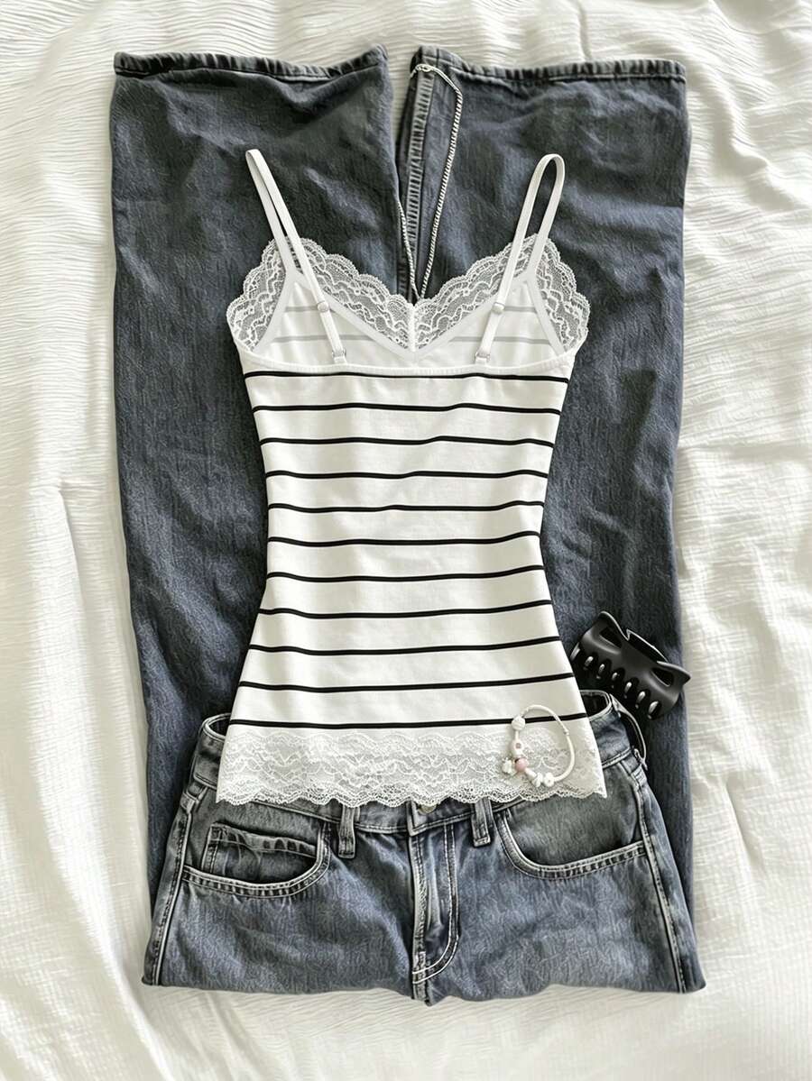 Women's solid color slim fit camisole top featuring delicate lace patchwork embroidery and tank straps.