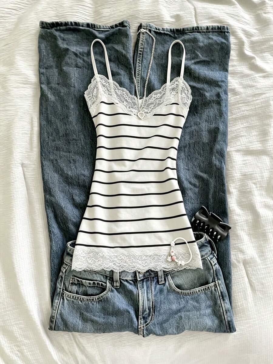 Women's solid color slim fit camisole top featuring delicate lace patchwork embroidery and tank straps.