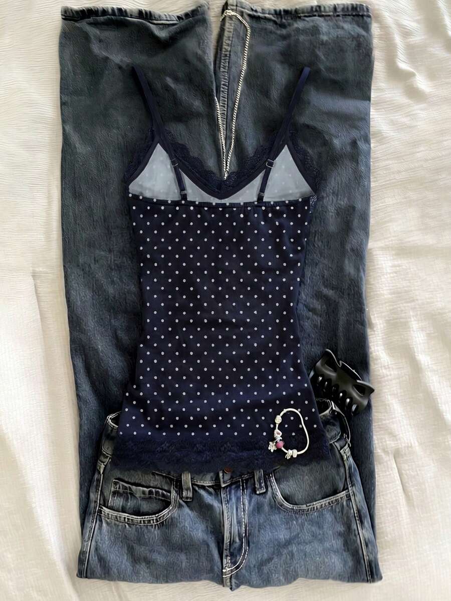 Women's solid color slim fit camisole top featuring delicate lace patchwork embroidery and tank straps.