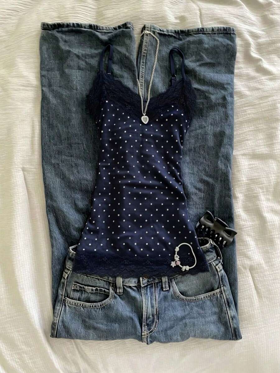 Women's solid color slim fit camisole top featuring delicate lace patchwork embroidery and tank straps.