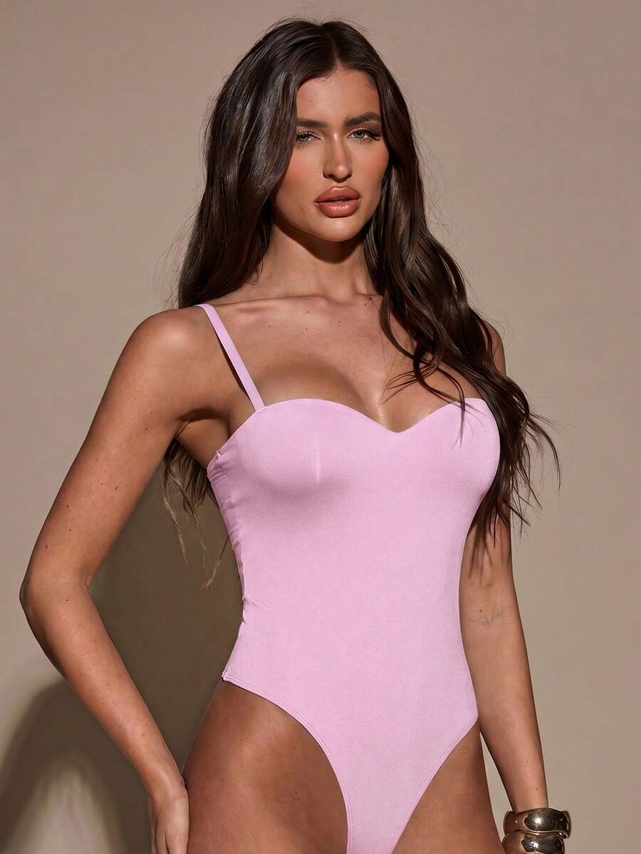 Apricot women's lace sheer camisole top featuring spaghetti straps, contrast lace trim, backless slim fit design, and knitted stretch fabric.