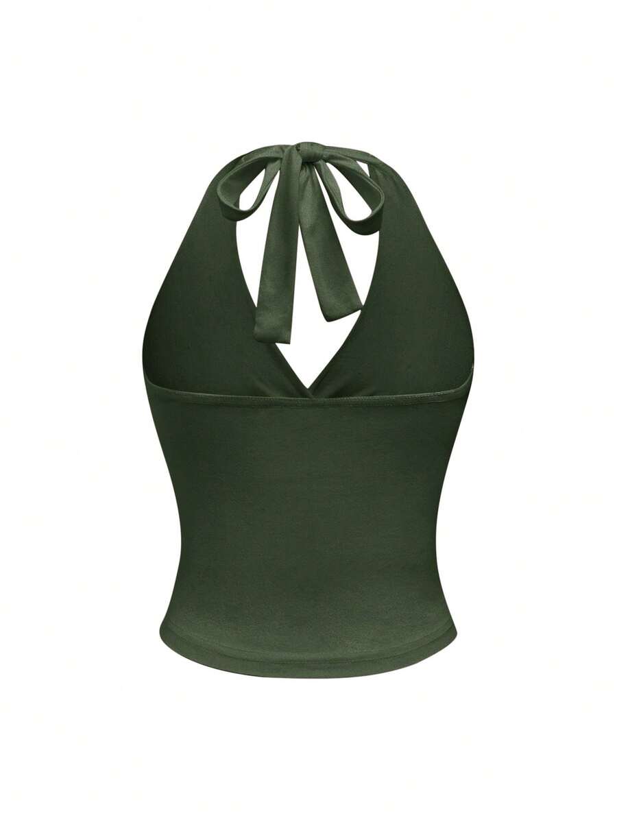 Women's halter crop tank top featuring a backless silhouette and ruched detailing in a slim fit design.