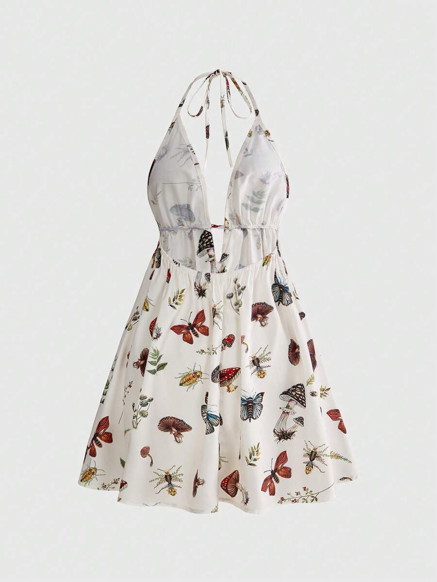 Black fairycore halter backless mini dress with mushroom, moth, and plant print featuring a high waist and flared hem.