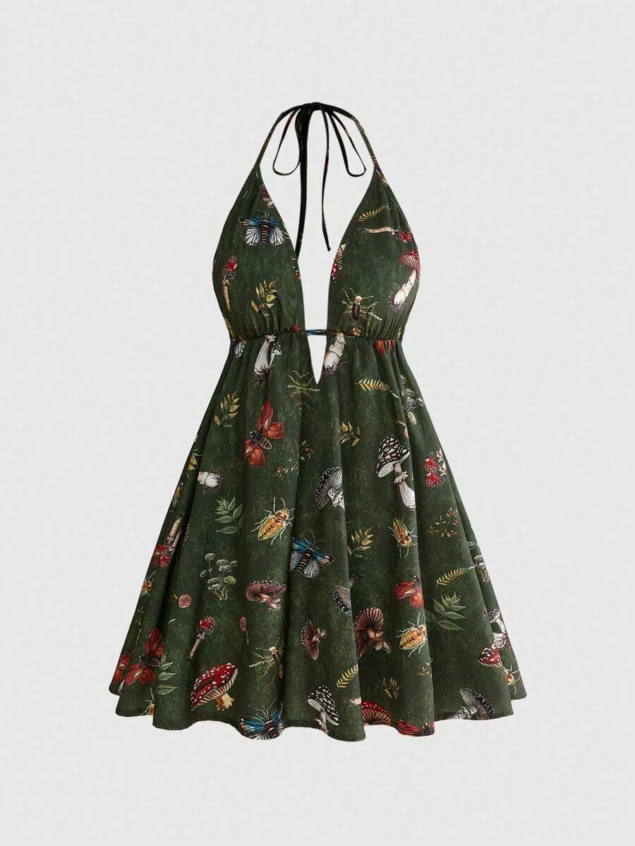 Black fairycore halter backless mini dress with mushroom, moth, and plant print featuring a high waist and flared hem.
