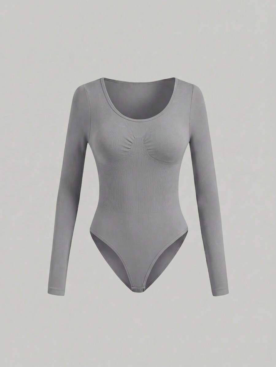 Black seamless long sleeve crew neck shapewear bodysuit for women featuring full coverage tummy control.