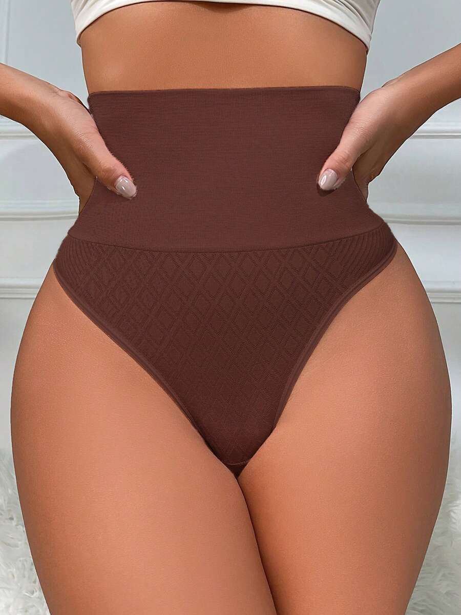 Black high waisted seamless shapewear thong for women featuring super high waist design and stretchy breathable fabric.