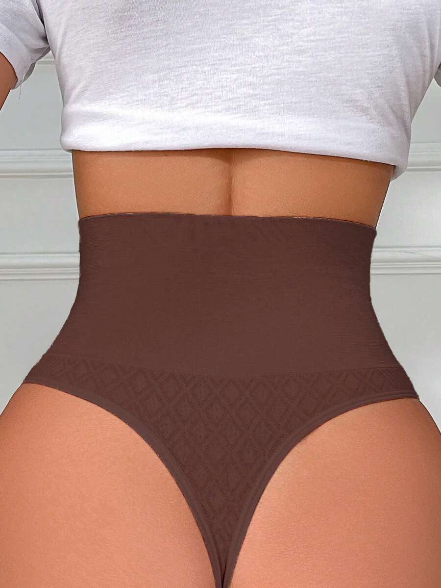 Black high waisted seamless shapewear thong for women featuring super high waist design and stretchy breathable fabric.