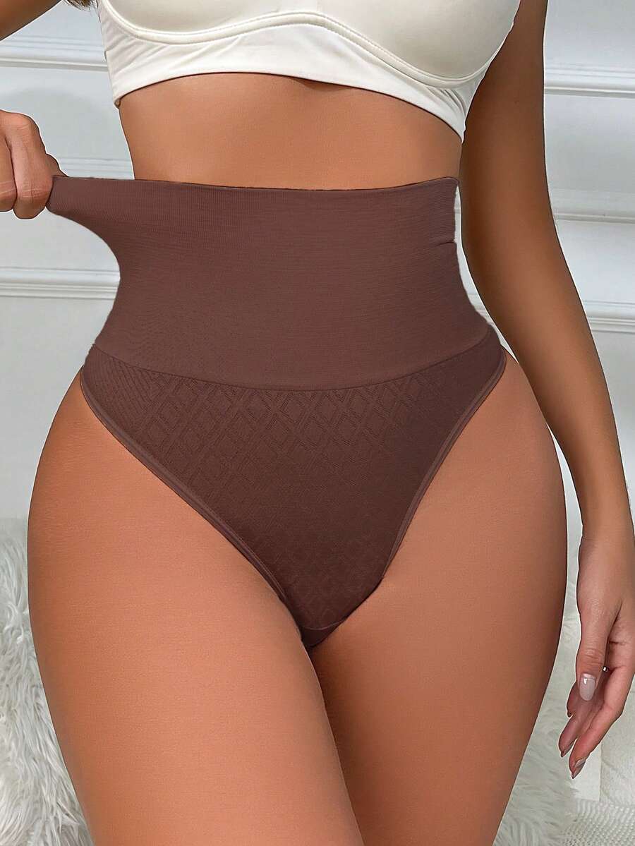 Black high waisted seamless shapewear thong for women featuring super high waist design and stretchy breathable fabric.