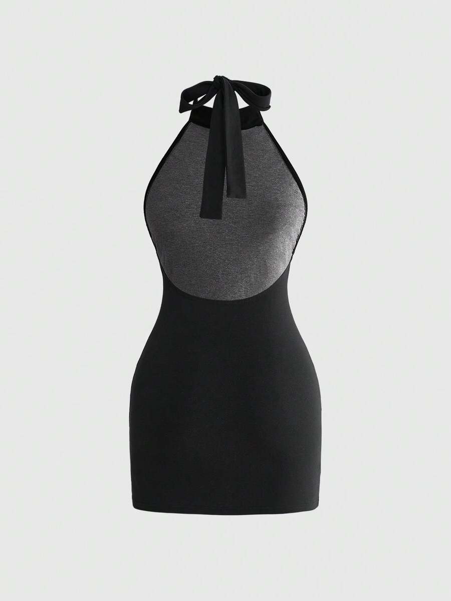 Black backless mini dress featuring letter slogan print, stand collar halter neck with tie back knot, and slim fit silhouette for festival style.