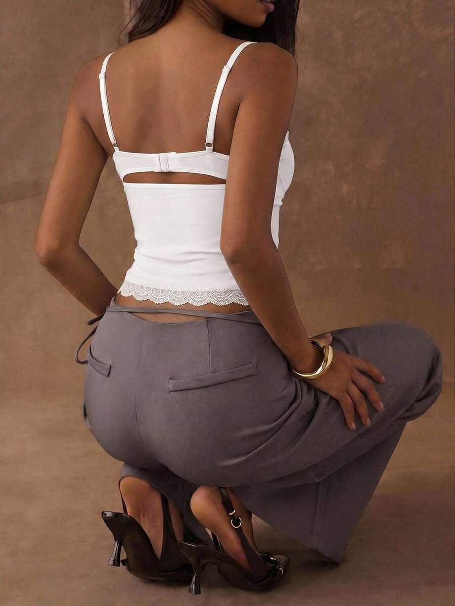 Women's black contrast lace camisole with spaghetti straps, cup detail, semi-sheer finish, and slim fit for going out or date night.