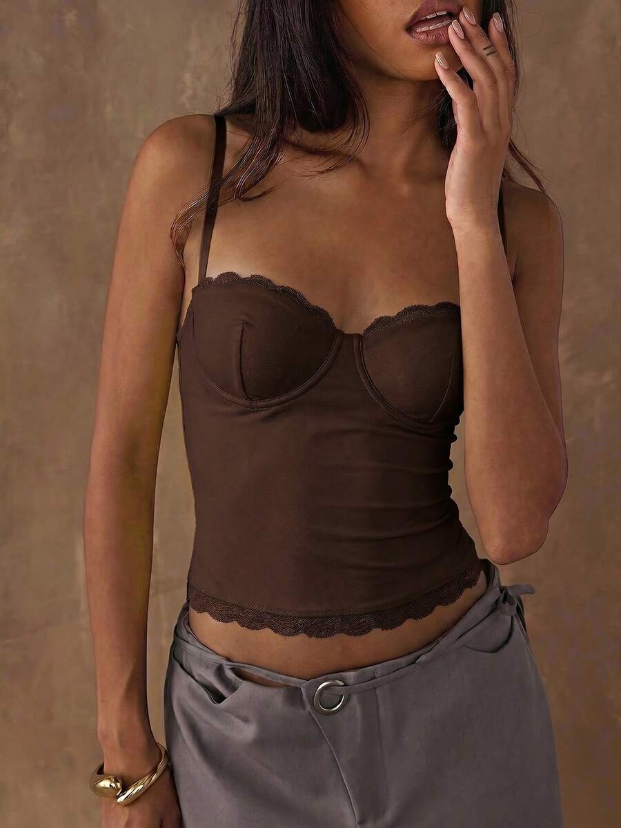 Women's black contrast lace camisole with spaghetti straps, cup detail, semi-sheer finish, and slim fit for going out or date night.