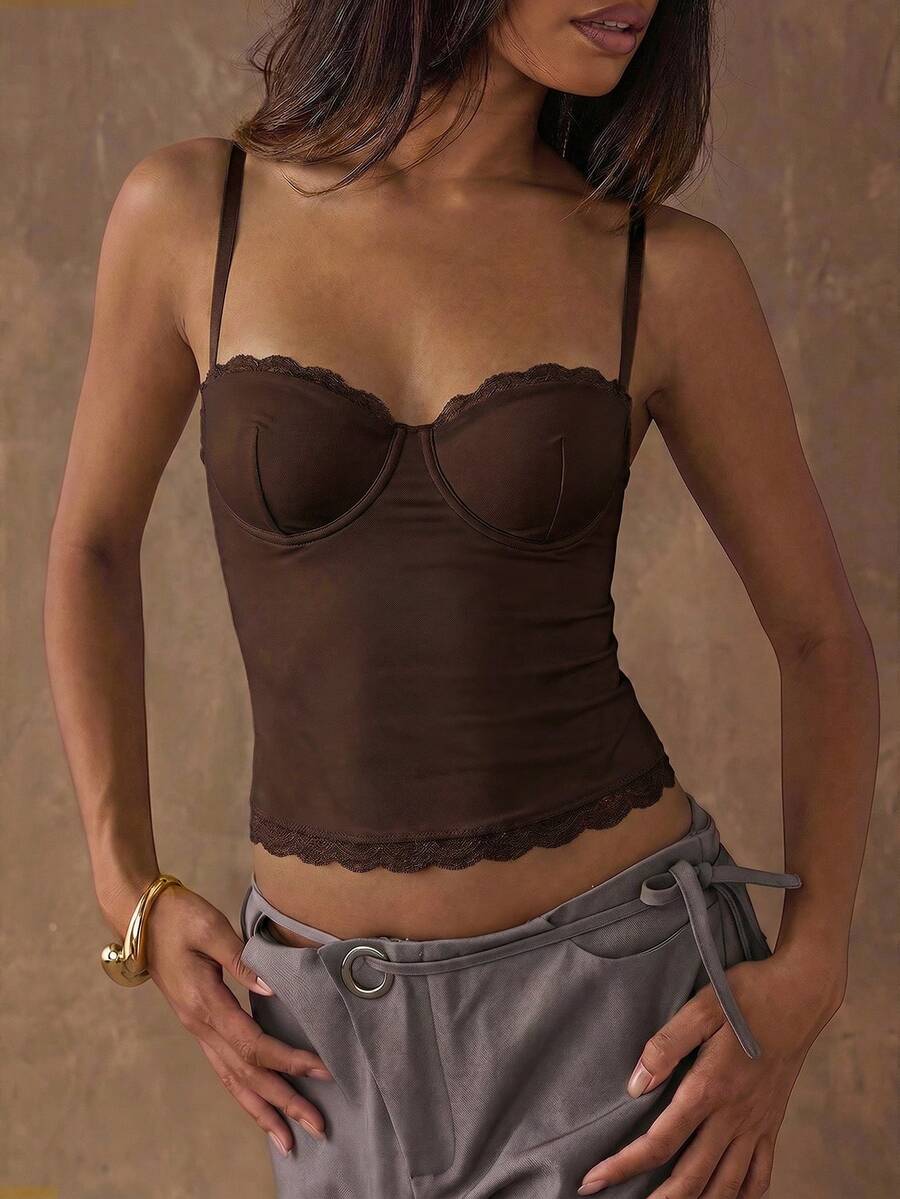 Women's black contrast lace camisole with spaghetti straps, cup detail, semi-sheer finish, and slim fit for going out or date night.