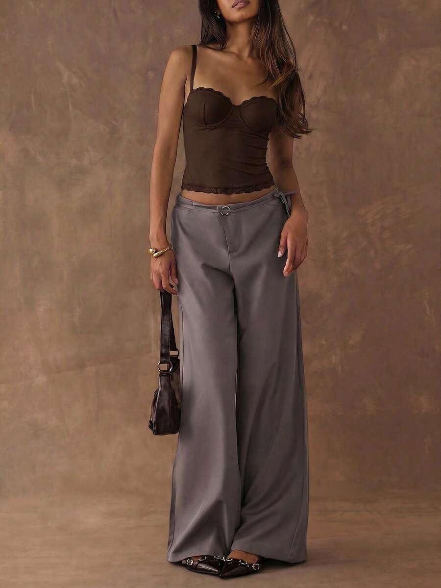 Women's black contrast lace camisole with spaghetti straps, cup detail, semi-sheer finish, and slim fit for going out or date night.