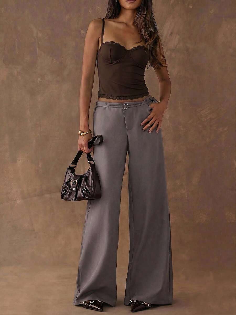 Women's black contrast lace camisole with spaghetti straps, cup detail, semi-sheer finish, and slim fit for going out or date night.