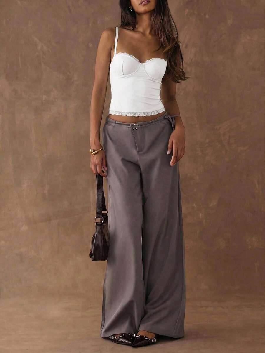 Women's black contrast lace camisole with spaghetti straps, cup detail, semi-sheer finish, and slim fit for going out or date night.