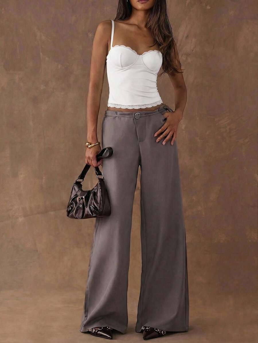 Women's black contrast lace camisole with spaghetti straps, cup detail, semi-sheer finish, and slim fit for going out or date night.