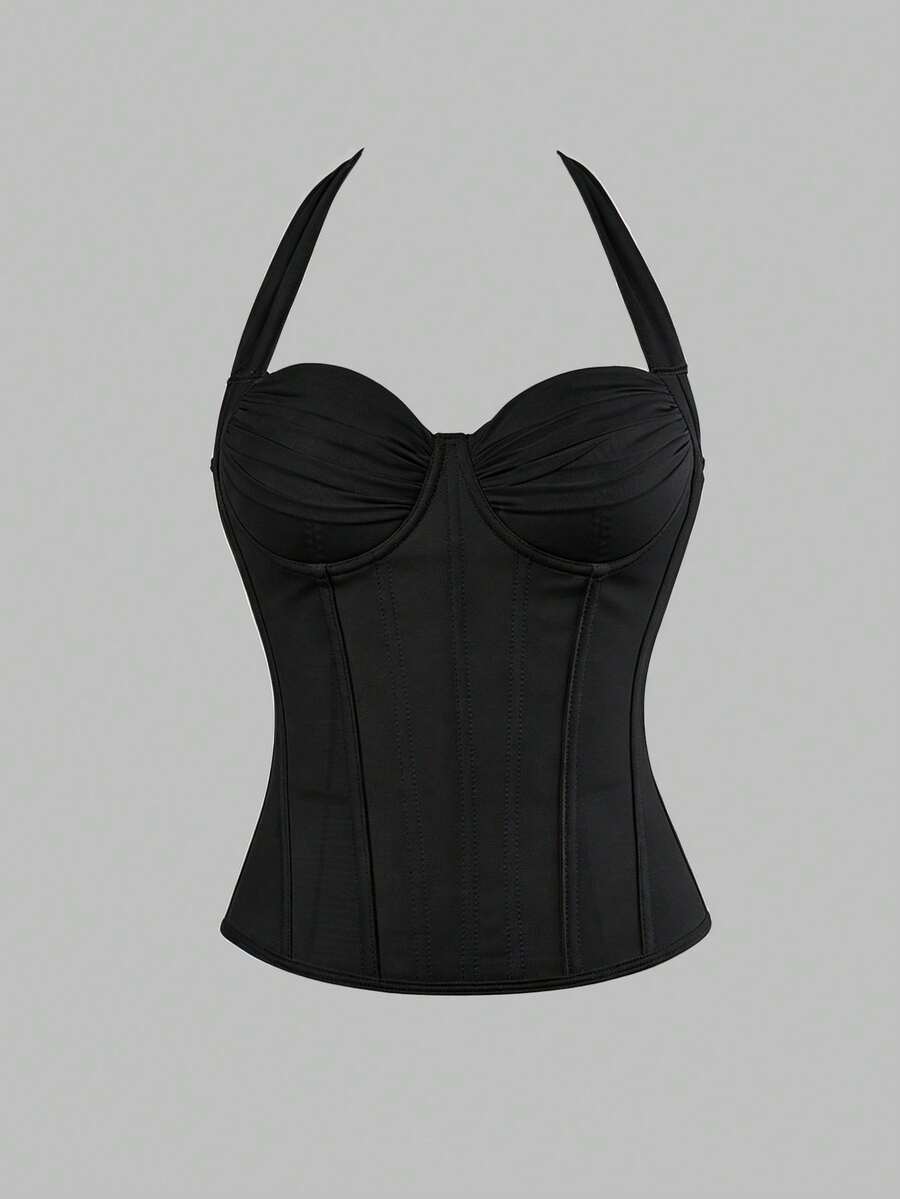 Women's white Y2K style corset cami top featuring a halter neckline, ruched detailing, asymmetrical hem, and backless lace-up design.