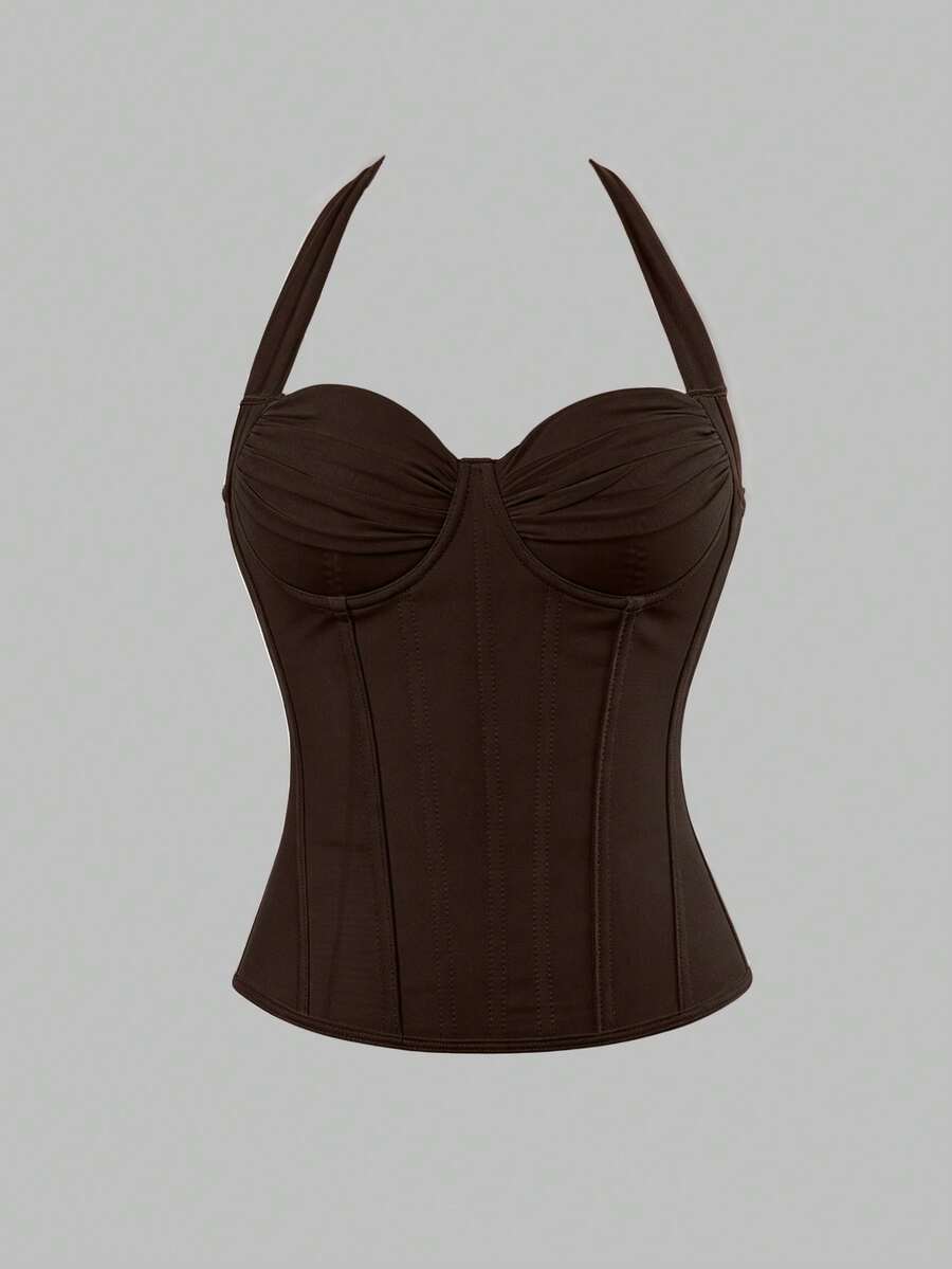 Women's white Y2K style corset cami top featuring a halter neckline, ruched detailing, asymmetrical hem, and backless lace-up design.