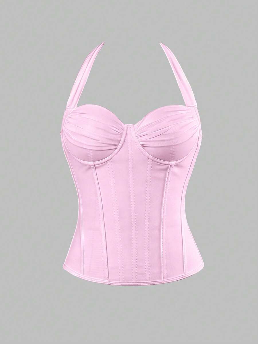 Women's white Y2K style corset cami top featuring a halter neckline, ruched detailing, asymmetrical hem, and backless lace-up design.