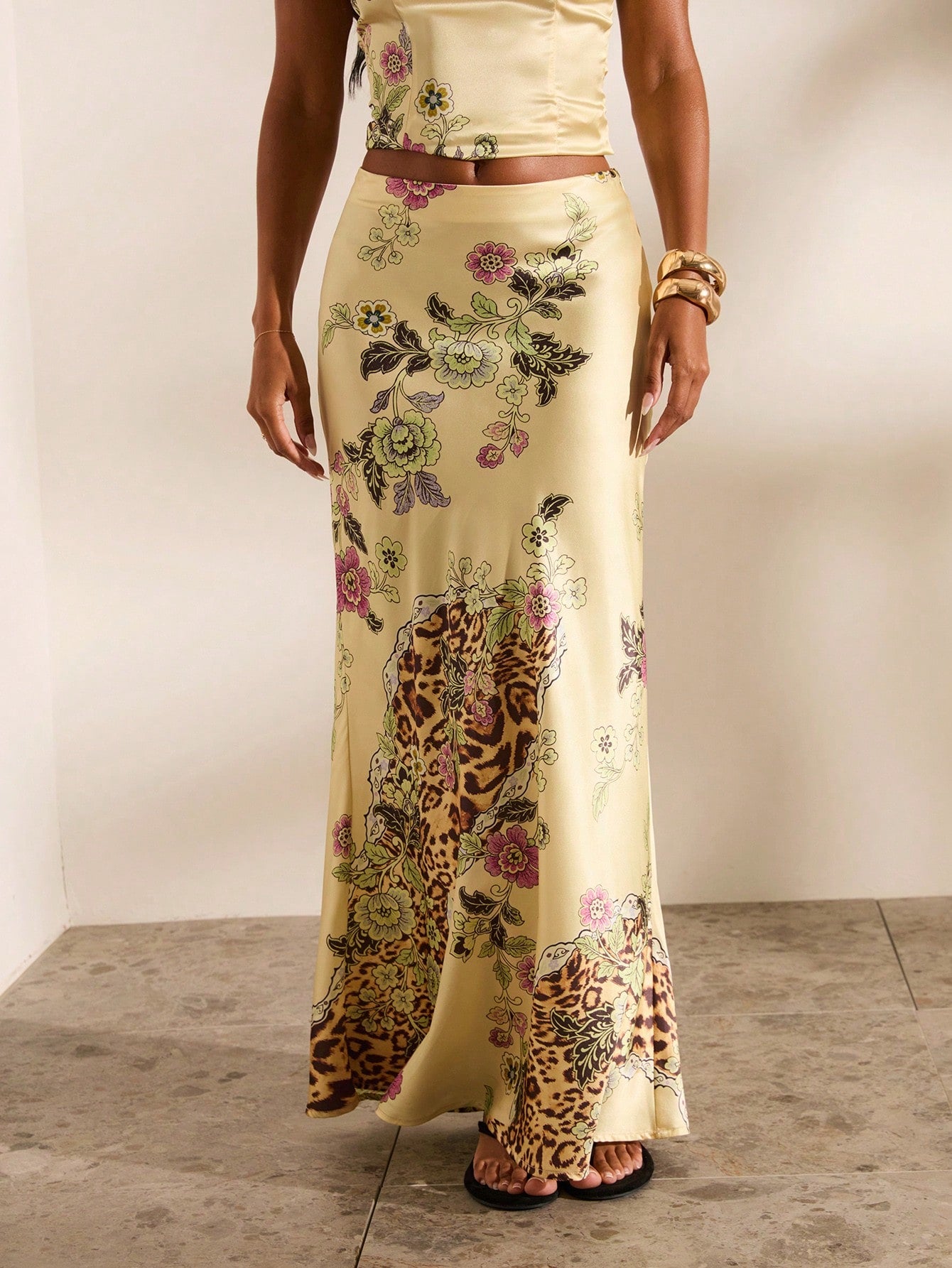 Women's black woven mermaid maxi skirt featuring a solid color design, mid waist, and 100% cotton fabric.