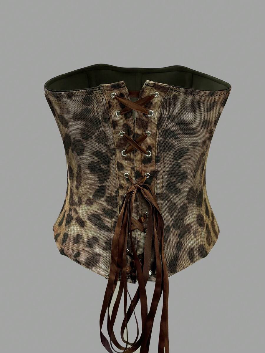 Black strapless mesh bustier top with a backless, semi-sheer design, slim fit, and crop length for women.