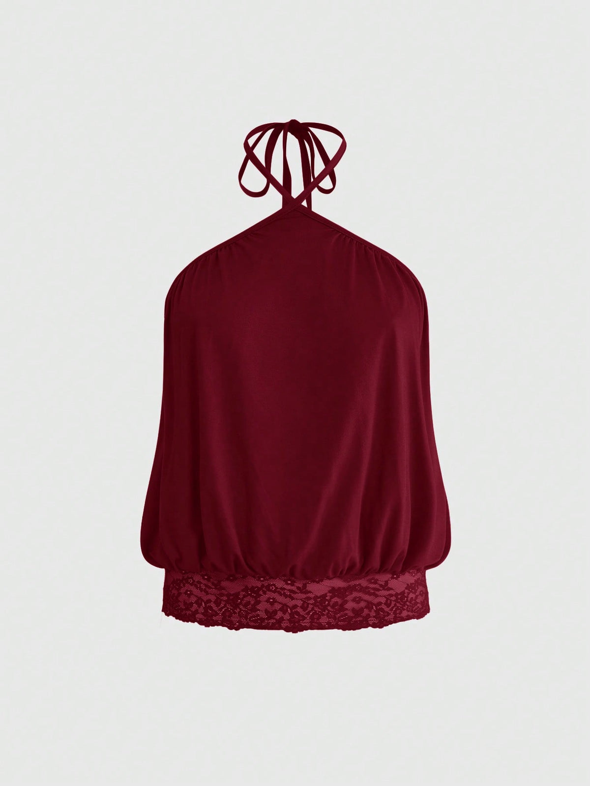 Woman wearing a black slim fit halter camisole crop top with lace-up backless tie detail.