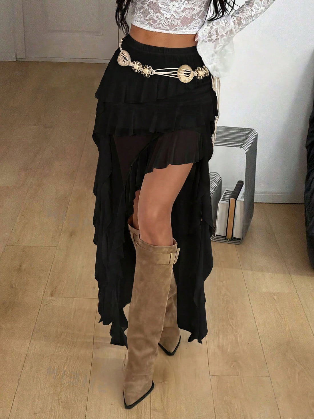 Women's low rise asymmetrical long skirt with tiered ruffle details in stretch knitted fabric.