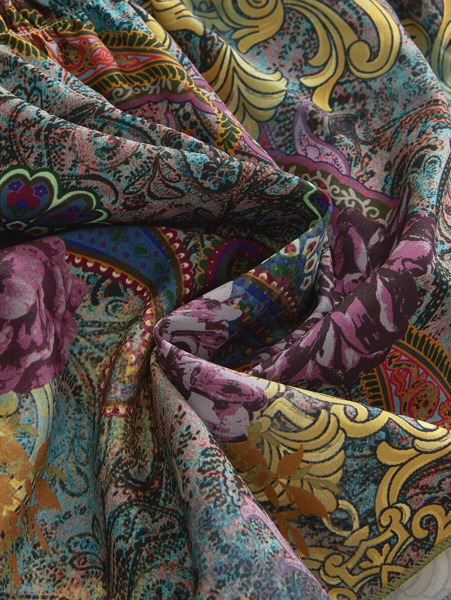 Women's multicolor paisley print halter loose mini dress featuring a backless knot detail and ruffle flounce hem