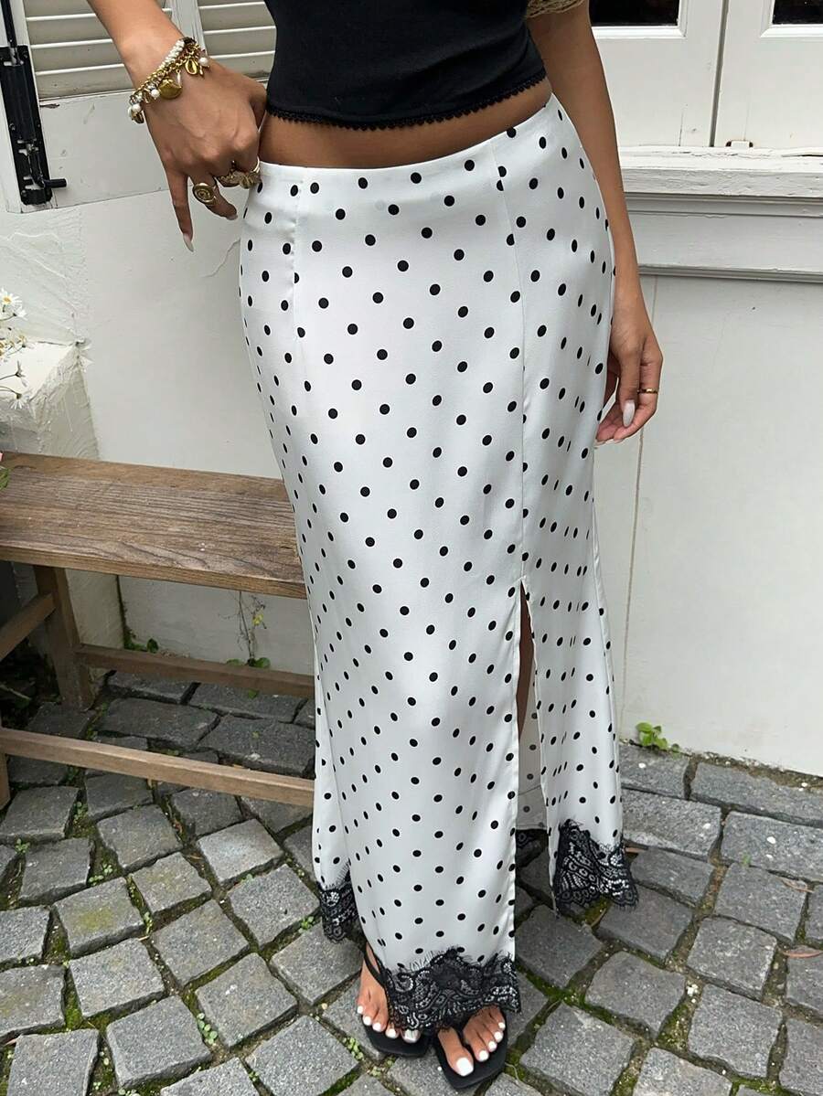 White long slit skirt for women featuring an elegant design with geometric textured pattern, mid-waist cut, and subtle studded details.