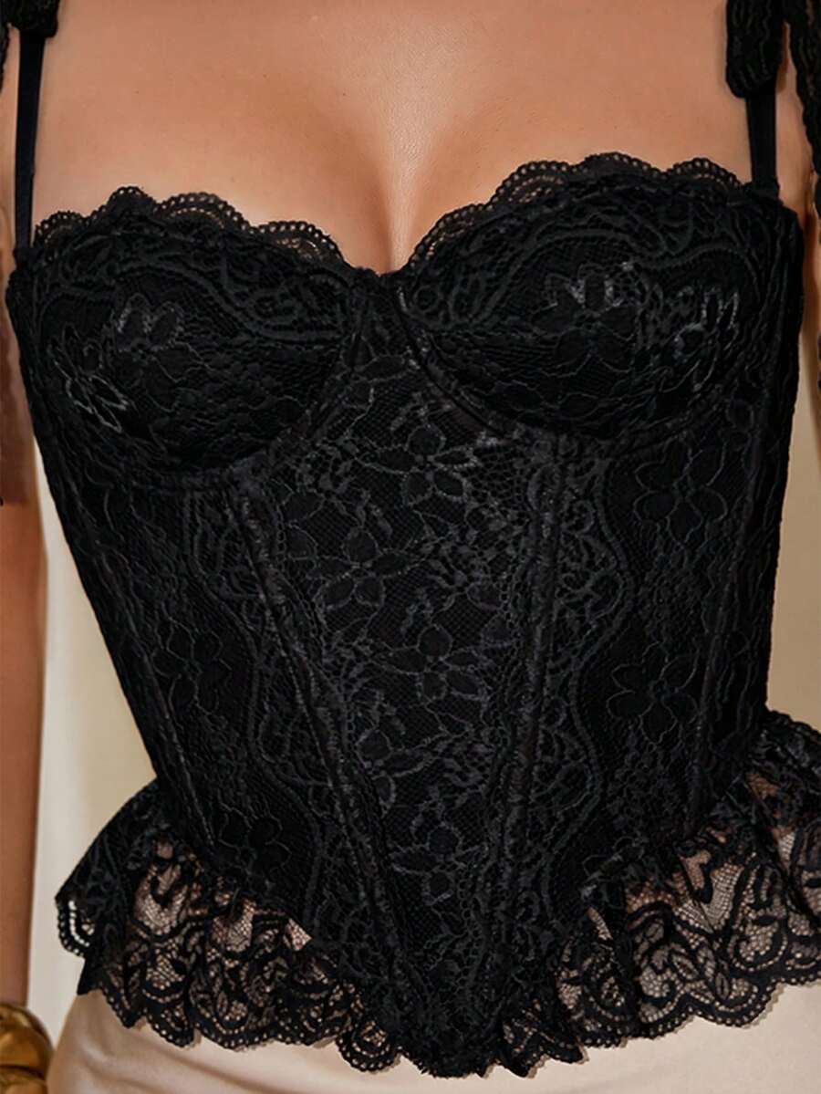 Women's lace camisole top featuring a boned bodice, sweetheart neckline, wide straps, and an asymmetrical crop hem.