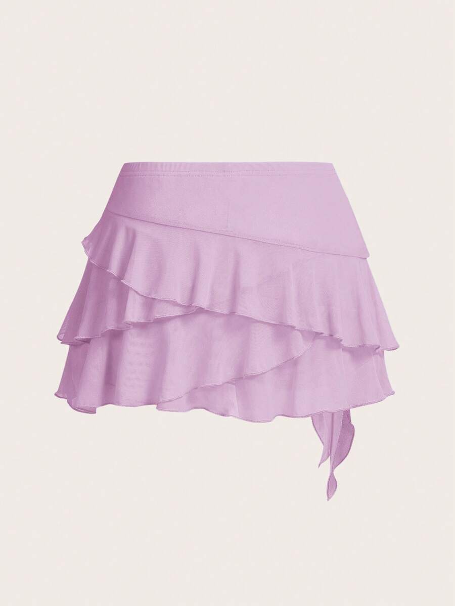 White tiered ruffle trim mini skirt for women with low waist, knot detail, mesh fabric, and casual Y2K boho design.