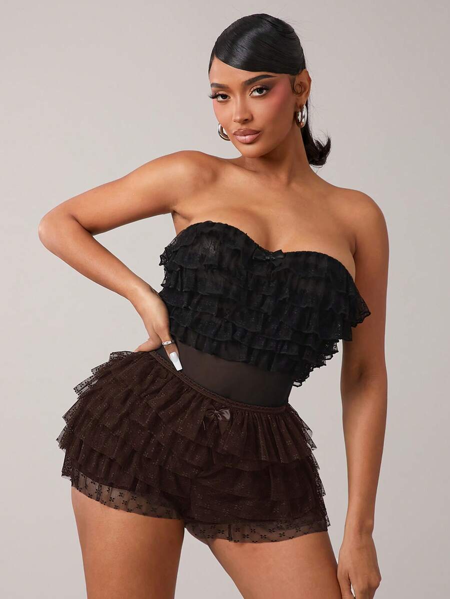 Apricot tiered lace ruffle hem low waist shorts for women featuring elastic waist and lined semi-sheer knit fabric.