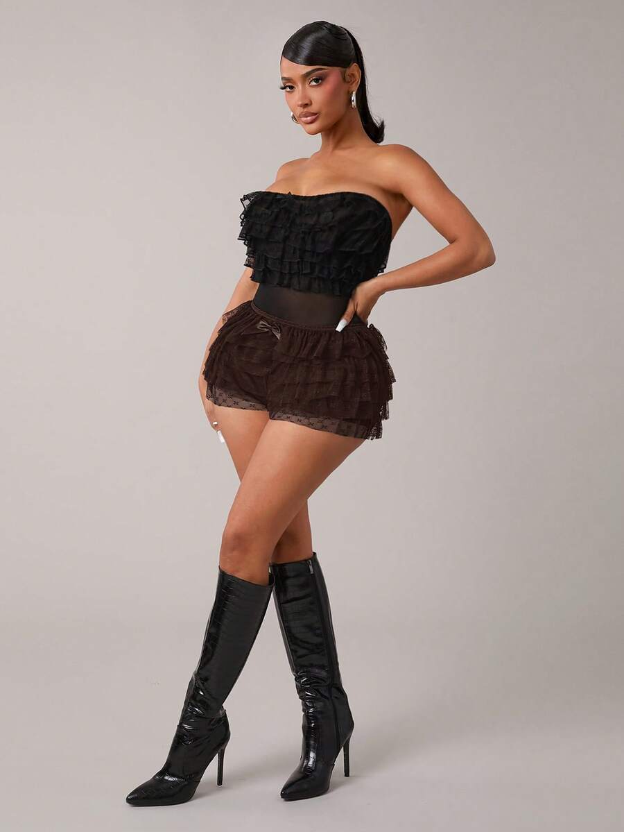 Apricot tiered lace ruffle hem low waist shorts for women featuring elastic waist and lined semi-sheer knit fabric.